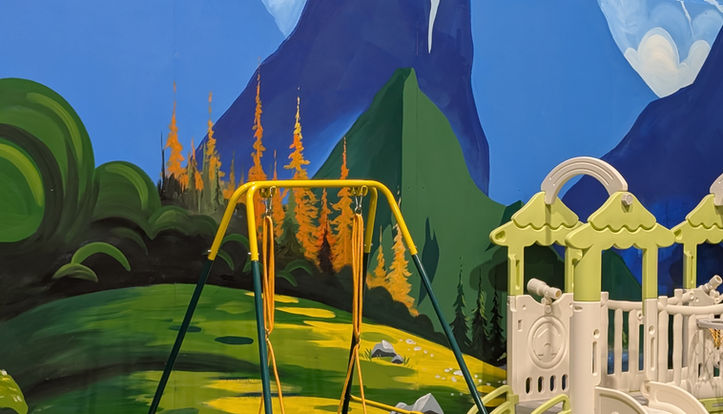 The Bees Knees Play Cafe located in Arab AL with mountain, grass background and toddler swing and slides